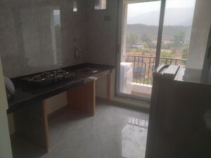 Kitchen in 1 BHK Apartment at Om Ved Heights, Shirgaon – for Sale