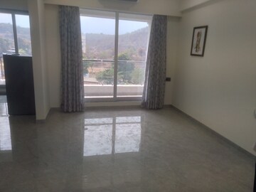 Living Room in 1 BHK Apartment at Om Ved Heights, Shirgaon – for Sale