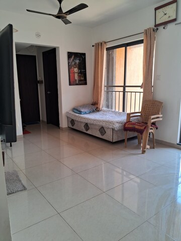 Living Room in 1.5 BHK Apartment at Dosti West County, Balkum Pada – for Rent
