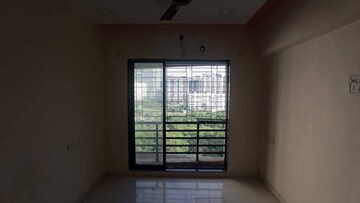 Living Room in 1 BHK Apartment at RNA NG Canary, Mira Road – for Sale