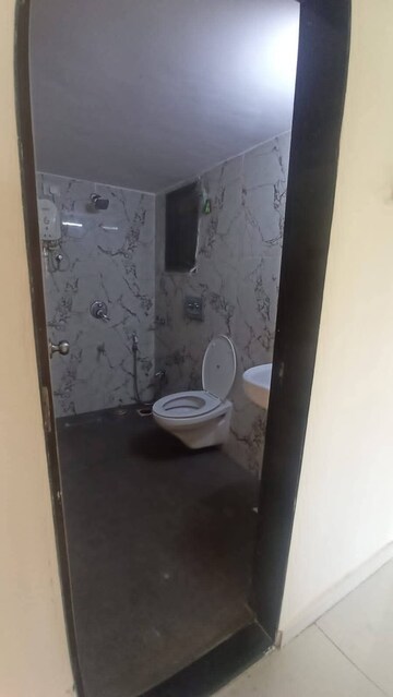 Bathroom in 1 BHK Apartment at RNA NG Canary, Mira Road – for Sale