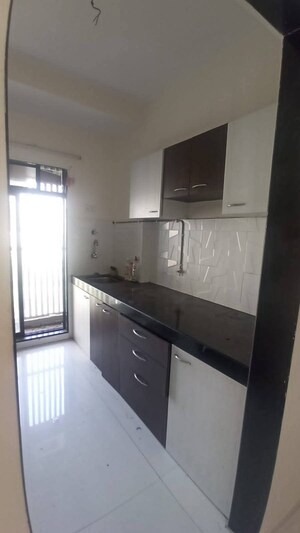 Kitchen in 1 BHK Apartment at RNA NG Canary, Mira Road – for Sale