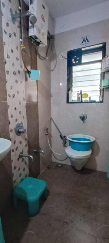 Bathroom in 1.5 BHK Apartment at Shree Satya Shankar Residency, Manpada – for Sale
