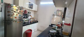 Kitchen in 1.5 BHK Apartment at Shree Satya Shankar Residency, Manpada – for Sale