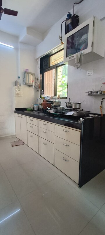 Kitchen in 1.5 BHK Apartment at Shree Satya Shankar Residency, Manpada – for Sale