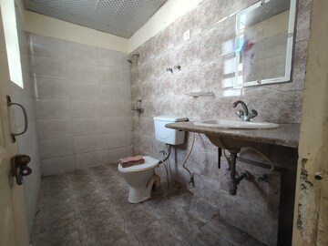 Bathroom in 2 BHK Apartment at NK Sharma Savitry Greens 2, Ghazipur – for Rent