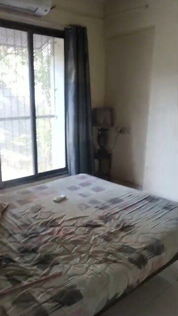 Bedroom in 1 BHK Apartment at Mahaanand CHS, Vile Parle East – for Rent