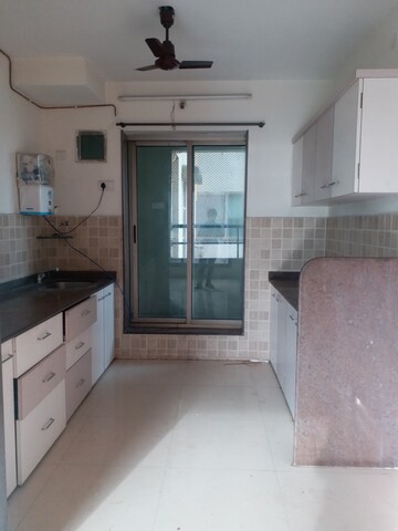 Kitchen in 3 BHK Apartment at Neelkanth Greens, Manpada – for Rent