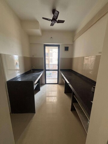 Kitchen in 1.5 BHK Apartment at Lodha Palava Downtown, Dombivli East – for Sale