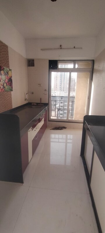 Kitchen in 1 BHK Apartment at Damji Shamji Kalpvruksha Tulip, Kasarvadavali – for Sale