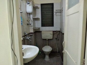 Bathroom in 3 BHK Apartment at Amber Park CHSL, Andheri West – for Rent