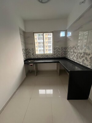 Kitchen in 2 BHK Builder Floor at Raj Shreeji Iconic, Badlapur East – for Sale