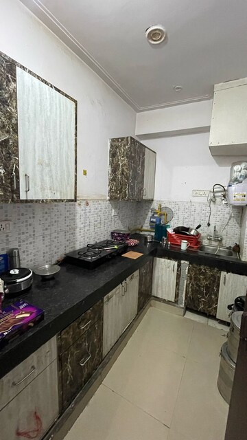Kitchen in 2.5 BHK Apartment at Nilaya Greens, Raj Nagar Extension – for Rent
