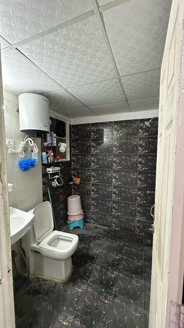Bathroom in 3 BHK Apartment at Nilaya Greens, Raj Nagar Extension – for Rent