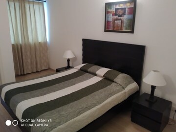 Bedroom in 3 BHK Apartment at DLF Park Place, Sector 54 – for Rent