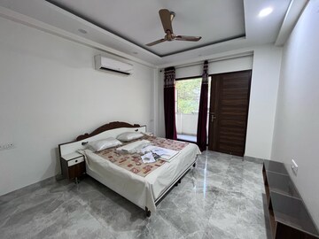 Bedroom in 4 BHK Builder Floor at Ansal Sushant Lok I, Sector 43 – for Rent