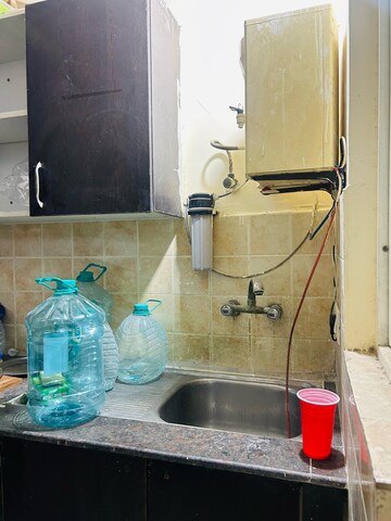 Kitchen in 2 BHK Apartment at Aims Golf City, Sector 75 – for Rent