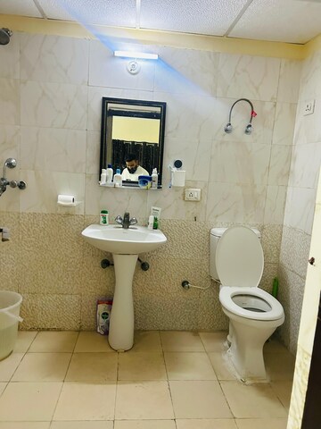 Bathroom in 2 BHK Apartment at Aims Golf City, Sector 75 – for Rent