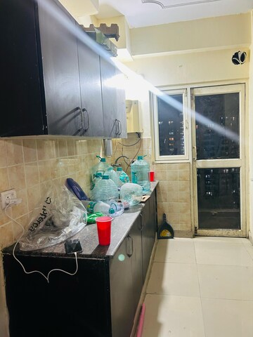 Kitchen in 2 BHK Apartment at Aims Golf City, Sector 75 – for Rent