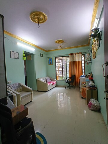 Living Room in 2 BHK Apartment at Aakruti Aangan CHS, Anand Nagar – for Rent
