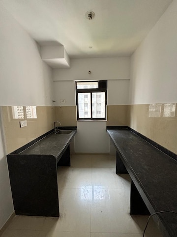 Kitchen in 1 BHK Apartment at Lodha Palava Downtown, Dombivli East – for Sale