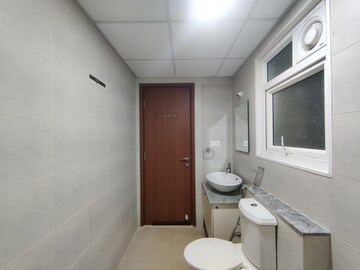 Bathroom in 2 BHK Apartment at Bhartiya Nikoo Homes Phase 2, Thanisandra Main Road – for Sale