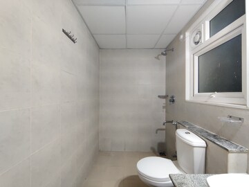 Bathroom in 2 BHK Apartment at Bhartiya Nikoo Homes Phase 2, Thanisandra Main Road – for Sale