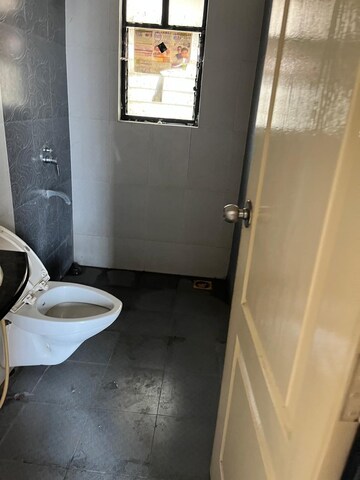 Bathroom in 3 BHK Apartment at Kolte Patil Margosa Heights, Mohammadwadi – for Rent