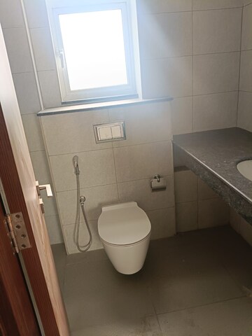 Bathroom in 3.5 BHK Apartment at Elite Golf Green, Sector 79 – for Rent