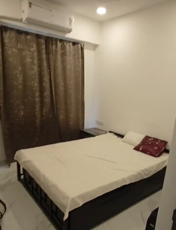 Bedroom in 2 BHK Apartment at Dev Leo Tower, Oshiwara – for Rent