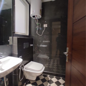 Bathroom in 3 BHK Builder Floor at Pamposh Enclave – for Rent