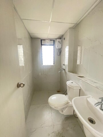 Bathroom in 1 BHK Apartment at Runwal Gardens, Dombivli East – for Rent