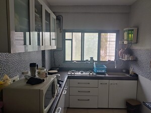 Kitchen in 2 BHK Apartment at Ani Anu Sri Balaji Enclave, Malad West – for Sale