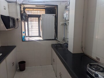 Kitchen in 2 BHK Apartment at Prathamesh Alfa CHS, Azad Nagar – for Rent