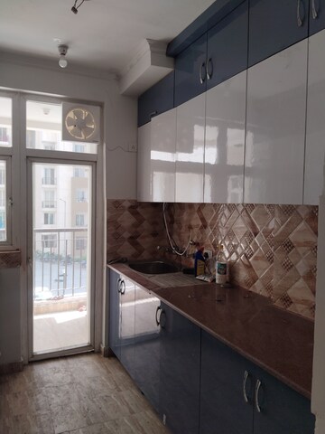 Kitchen in 3 BHK Apartment at Amrapali Riverview, Amrapali Leisure Valley – for Rent