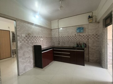 Kitchen in 2 BHK Apartment at Shivanand CHS Naupada, Naupada – for Sale