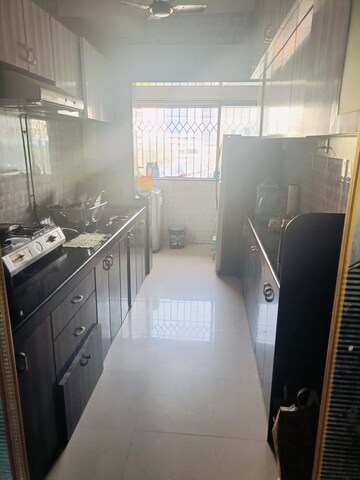 Kitchen in 2 BHK Apartment at Palash Towers, Andheri West – for Rent
