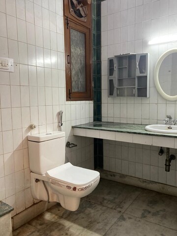 Bathroom in 4 BHK Apartment at Boutique Residential Apartments C-253, Defence Colony – for Rent