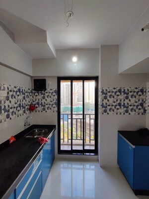 Kitchen in 1 BHK Apartment at Unnathi Woods Phase 3, Ghodbunder Road – for Sale