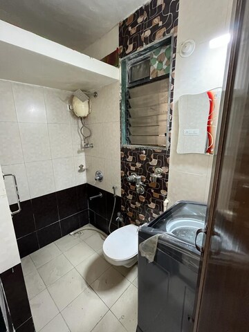 Bathroom in 1 BHK Apartment at Unnathi Woods Phase 3, Ghodbunder Road – for Sale