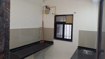 Kitchen in 1.5 BHK Apartment at Dosti Eden, Brahmand – for Rent