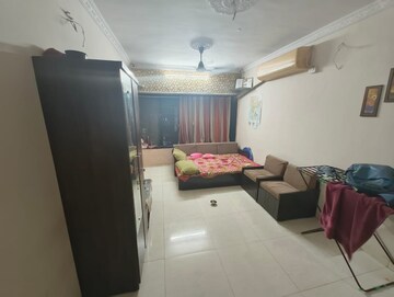 Living Room in 1.5 BHK Apartment at STC Employees CHS, Andheri East – for Sale