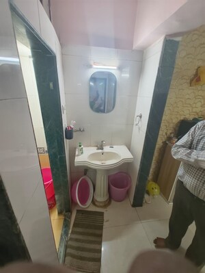 Bathroom in 1.5 BHK Apartment at STC Employees CHS, Andheri East – for Sale
