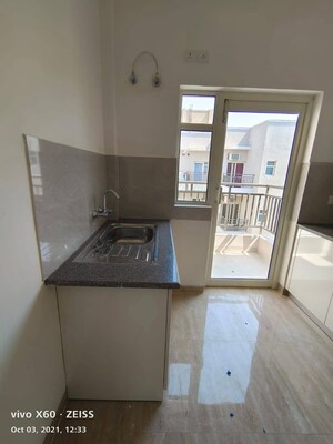 Kitchen in 3.5 BHK Apartment at Puri Aman Vilas, Sector 89 – for Sale