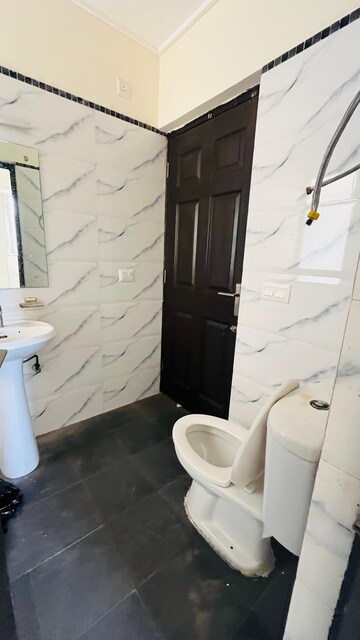 Bathroom in 2 BHK Apartment at Antriksh Golf View, Sector 78 – for Rent