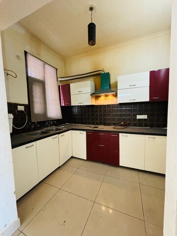 Kitchen in 3 BHK Builder Floor at Ansal API Victoria Floors, Dhakoli Village – for Sale