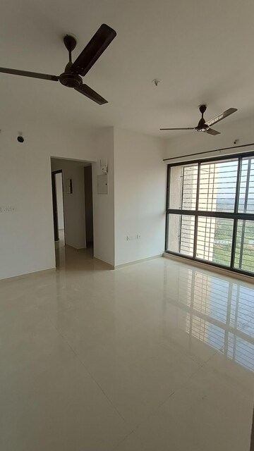 Living Room in 2 BHK Apartment at Lodha Palava Downtown Dombivli East, Dombivli East – for Rent