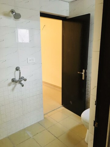 Bathroom in 2 BHK Apartment at Grah Avas Green View Heights, Raj Nagar Extension – for Rent