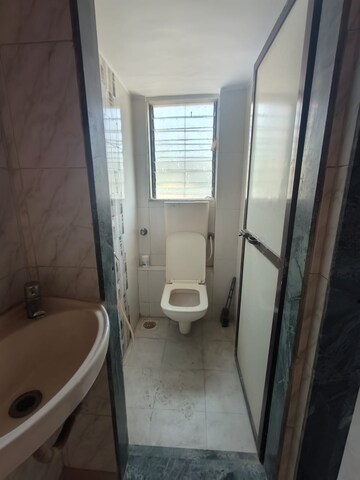 Bathroom in 1 BHK Apartment at Andheri CHS, Andheri West – for Rent
