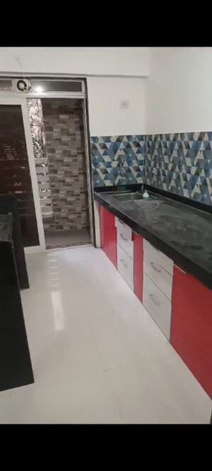 Kitchen in 1 BHK Apartment at Cosmos Orchid, Ghodbunder Road – for Sale